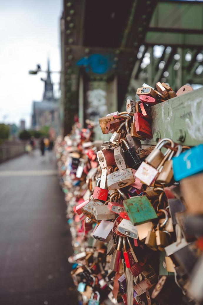 a bunch of padlocks on a bridge